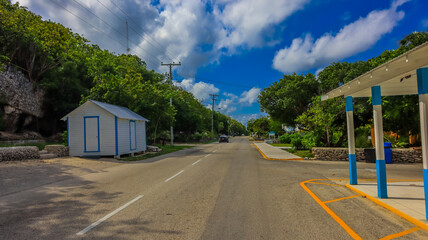 Cayman Brac road and building in sister island of Grand Cayman in the Cayman Islands british...