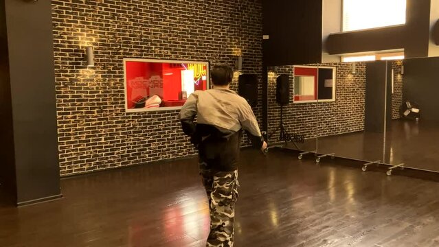 Gay male dancer struts his stuff in dance studio