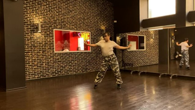 Gay male dancer performs contemporary lyrical dance routine in heels