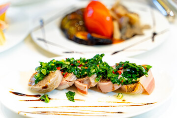A Delicious Plate of Meat and Veggies. A white plate topped with meat and veggies