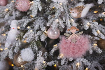 A close-up of a Christmas tree background (white and dusty pink colors)