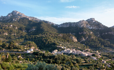 Fototapeta na wymiar Panoramic landscape view of a Mediterranean mountain village of Estellencs, in the Sierra de Tramuntana in the island of Majorca, Balearic Islands, Spain, Europe