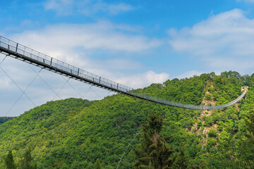Fototapeta na wymiar The Geierlay suspension cable bridge is a pedestrian cable bridge in Rhineland-Palatinate, Germany