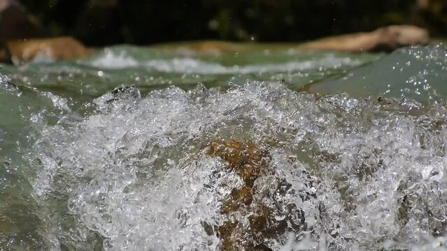 water waves on rocks in the river