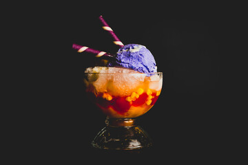 Filipino halo-halo made with crushed ice, evaporated milk and purple yam ice cream