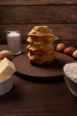 Set Of Ingredients For Baking Baumkuchen, Sakotis, Handmade sekacz On Wooden Table, Traditional Spit Cake Of Lithuanian, Polish, German,belarusian Cuisine Made Of Butter,eggs, Flour,sugar. Vertical.
