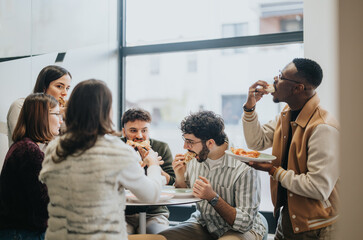 Confident coworkers enjoying a relaxing lunch break together, discussing and refueling their energy...