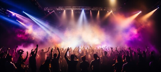 Dynamic and energetic concert stage with vibrant bokeh lights and blurred crowd in the background