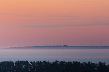 Sunrise over fog