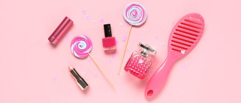 Set of female accessories with lollipops and confetti on pink background