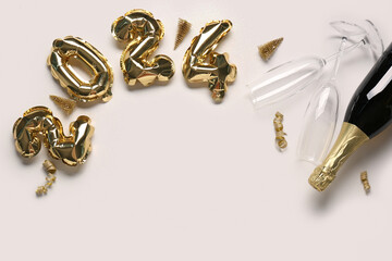 Figure 2024 made of balloons with Christmas decorations, glasses and bottle of champagne on white background