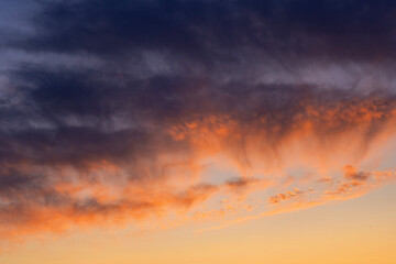 Colorful sunset with clouds in the evening, Fantastic view of the dark overcast sky. Dramatic and picturesque morning scene, Panorama of a textured purple sky at sunset