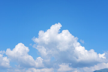 Naklejka na ściany i meble Beautiful blue sky background with white cloud. Abstract nature background, summer cloudscape