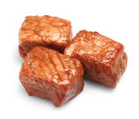 Pieces of delicious cooked beef isolated on white. Tasty goulash