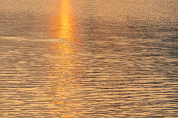 Abstract bokeh background from summer blue sea water at the beach - panoramic banner. Water bokeh...