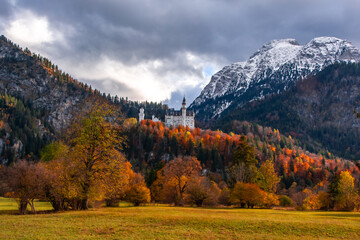 Fall colors around Neuschwanstein with snow on the Alps