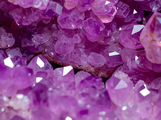 Amethyst red crystals. Gems. Mineral crystals in the natural environment. Texture of precious and semiprecious stones.