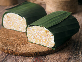 Raw tempe wrapped in banana leaves, Indonesian traditional food, create from soybean