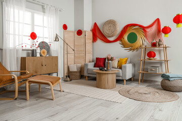 Interior of festive living room with traditional Chinese decorations, sofa and wooden furniture....