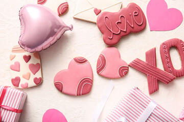 Sweet cookies with gifts and balloon on white grunge background. Valentine's Day celebration