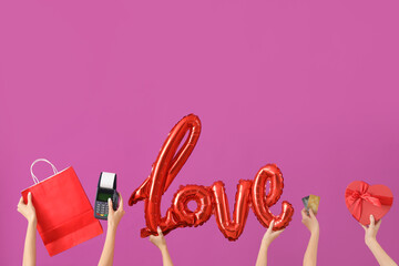 Women with shopping bag, payment terminal, word LOVE and credit cards on purple background. Valentine's Day celebration