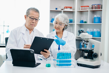 Scientist two woman with tablet and laptop, laboratory and ecofriendly science. Agriculture, research and scientists with online reading, test samples