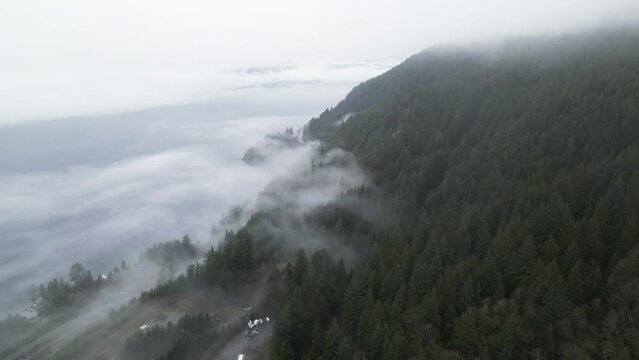 Howe Sound covered in Clouds and Fog during morning. Aerial Panorama. BC, Canada.