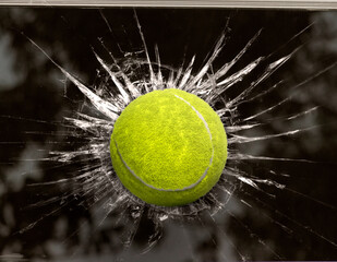 Tennis ball through broken window