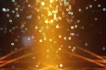 Abstract golden glitter bokeh lights in black blur background. Defocused circular image.