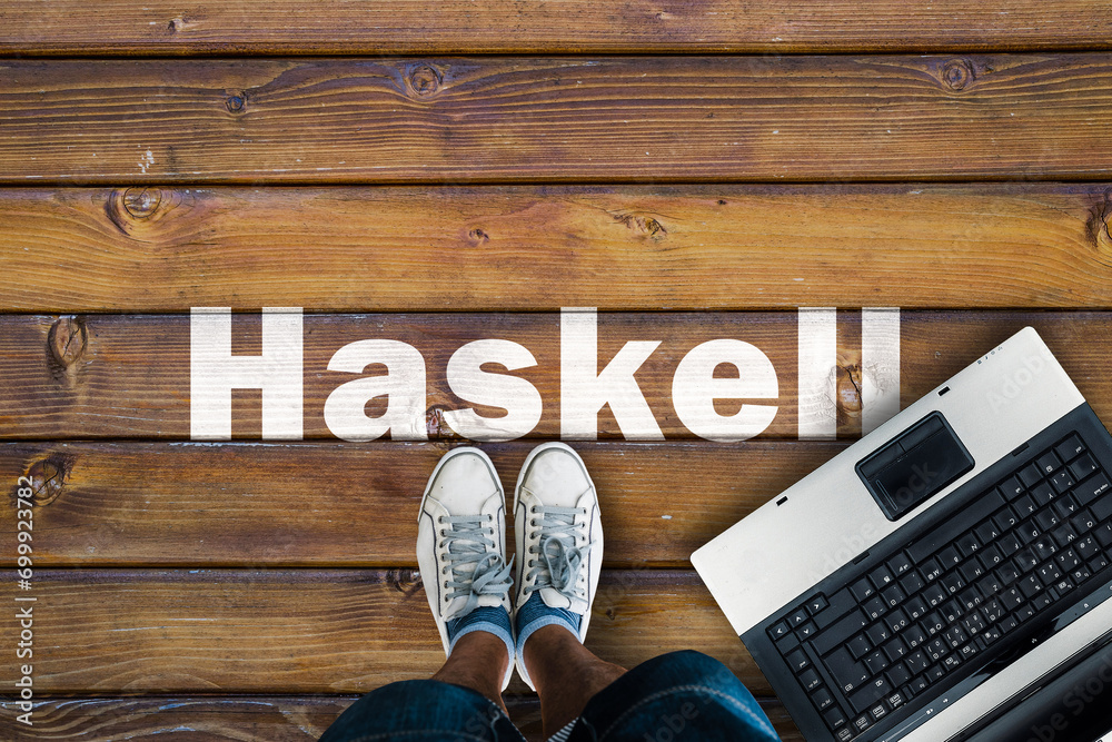 Poster Legs in sneakers standing next to laptop and Haskell on wooden floor. Haskell programming language.
