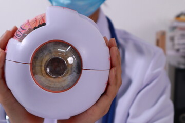 Close up of the ears of a professional female doctor in uniform taking notes in a notebook Medical...