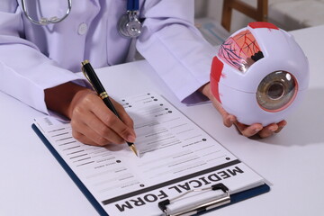 Close up of the ears of a professional female doctor in uniform taking notes in a notebook Medical...