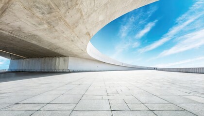 Obraz premium A light grey cement building at the blue sky.
