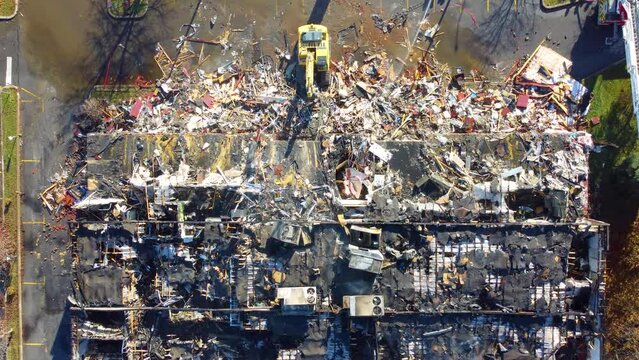 Closing in on Abandoned Building Being Demoslished After Fire, Wide, Aerial Shot