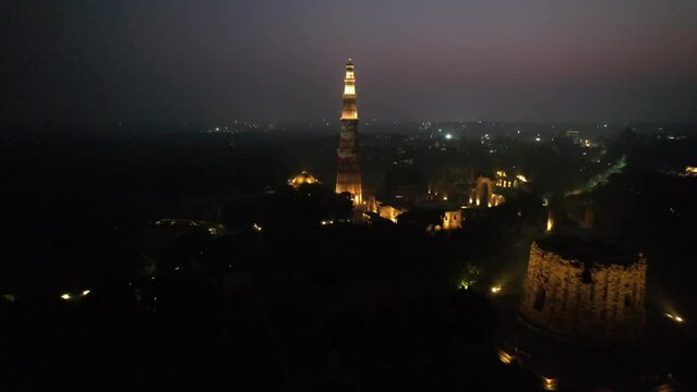 A Night Aerial shot of Qutub Minar at New Delhi in India
