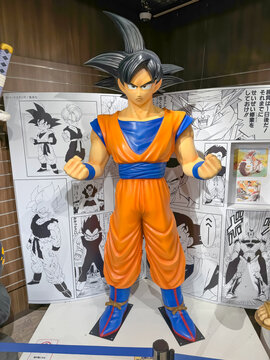 Kita Ward, Osaka, Japan. Dec 24, 2023. A human size model Goku from Dragon Ball comic cartoon character figure at a Jump Shop at HEP FIVE mall.