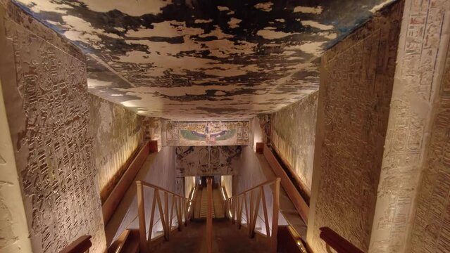 Luxor, Egypt - November 25 2023: Point of view of a tourist who walks down the stairs into the interior of the Seti the first tomb in the valley of Kings in Luxor in Egypt. 