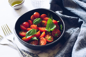 Healthy salad with cherry tomatoes and basil  - Powered by Adobe