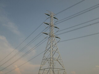 Next to the high voltage pole
