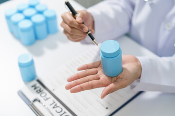 Specialist medical professionals check the quality and expiration date of the vials and medicine capsules.