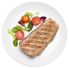 grilled cooked piece of tuna fillet on ceramic plate isolated