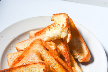 Toast with butter and sprinkle with sugar