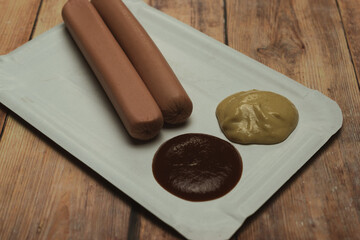 Sausage on a paper plate