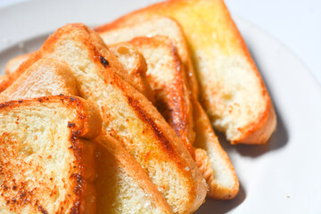 Toast with butter and sprinkle with sugar