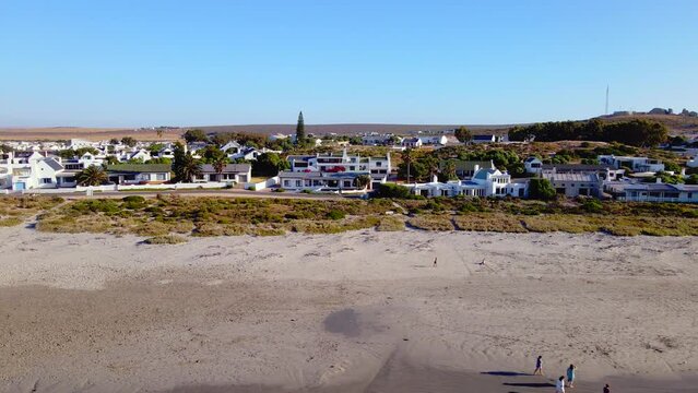 White-washed fishermen's cottages along beach of Paternoster, West Coast. Aerial
