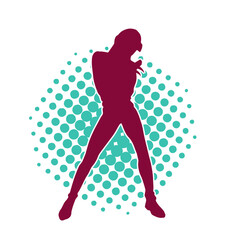 Silhouette of a casual female in a dancing pose. Silhouette of a dancer woman in action pose.