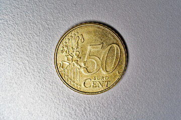 Close-up of golden Euro Cent coin value 50 cents against gray background. Photo taken December 28th, 2023, Zurich, Switzerland.