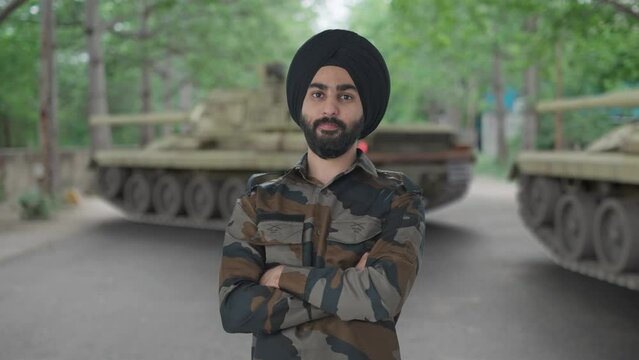 Confident Sikh Indian Army man standing crossed hands
