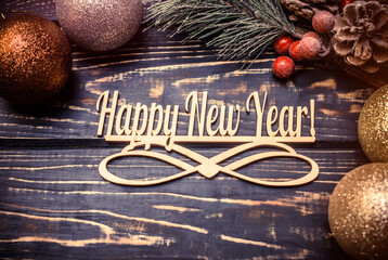 Happy new year  on wooden brown background.
