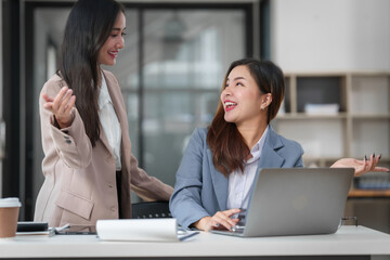 Two Asian businesswomen working together, meeting and discuss of new business project, professional people.